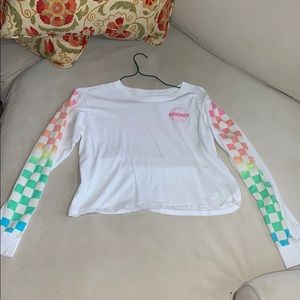 A cropped long sleeve shirt with a logo